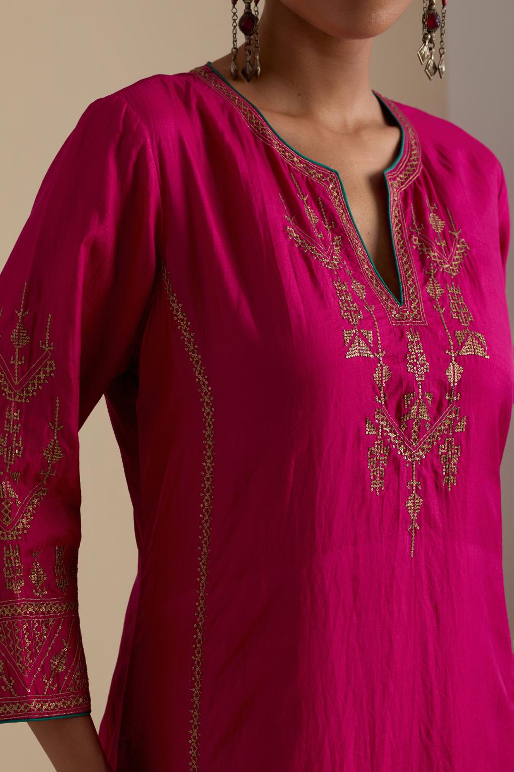 Fuchsia silk straight long kurta set with side panels, highlighted with dull gold zari and sequins handwork.