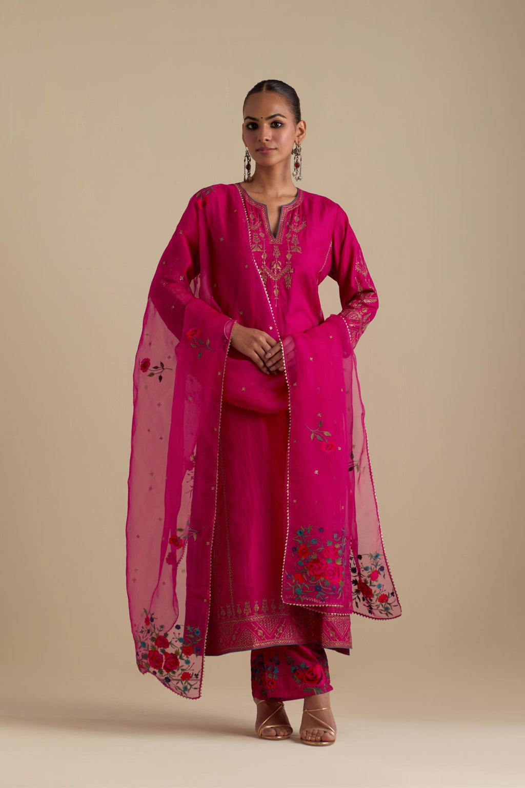 Fuchsia silk straight long kurta set with side panels, highlighted with dull gold zari and sequins handwork.