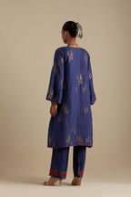 Blue silk A-line short kurta set, highlighted with dull gold zari and sequins handwork.