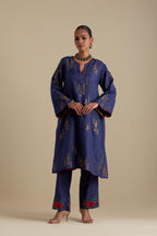 Blue silk A-line short kurta set, highlighted with dull gold zari and sequins handwork.