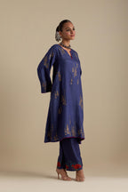 Blue silk A-line short kurta set, highlighted with dull gold zari and sequins handwork.