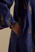 Blue silk A-line short kurta set, highlighted with dull gold zari and sequins handwork.