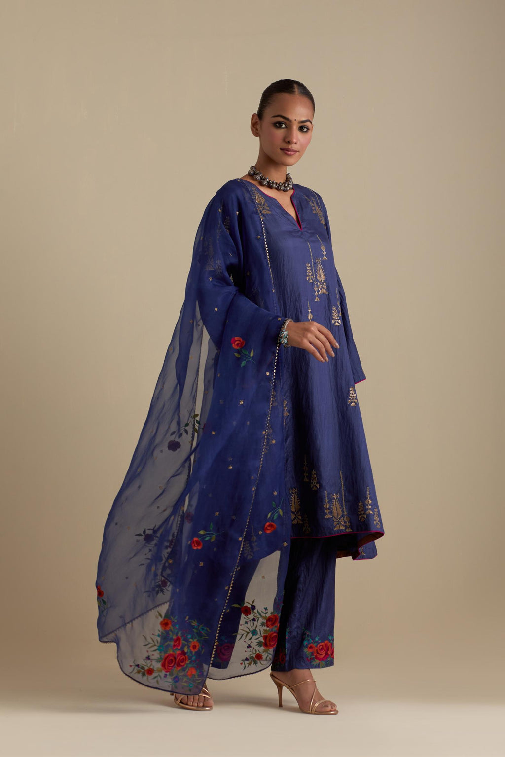 Blue silk organza dupatta, highlighted with delicate dull gold sequins work and all-over thread embroidery roses, with a large bunch at the dupatta corners.