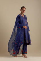 Blue silk A-line short kurta set, highlighted with dull gold zari and sequins handwork.