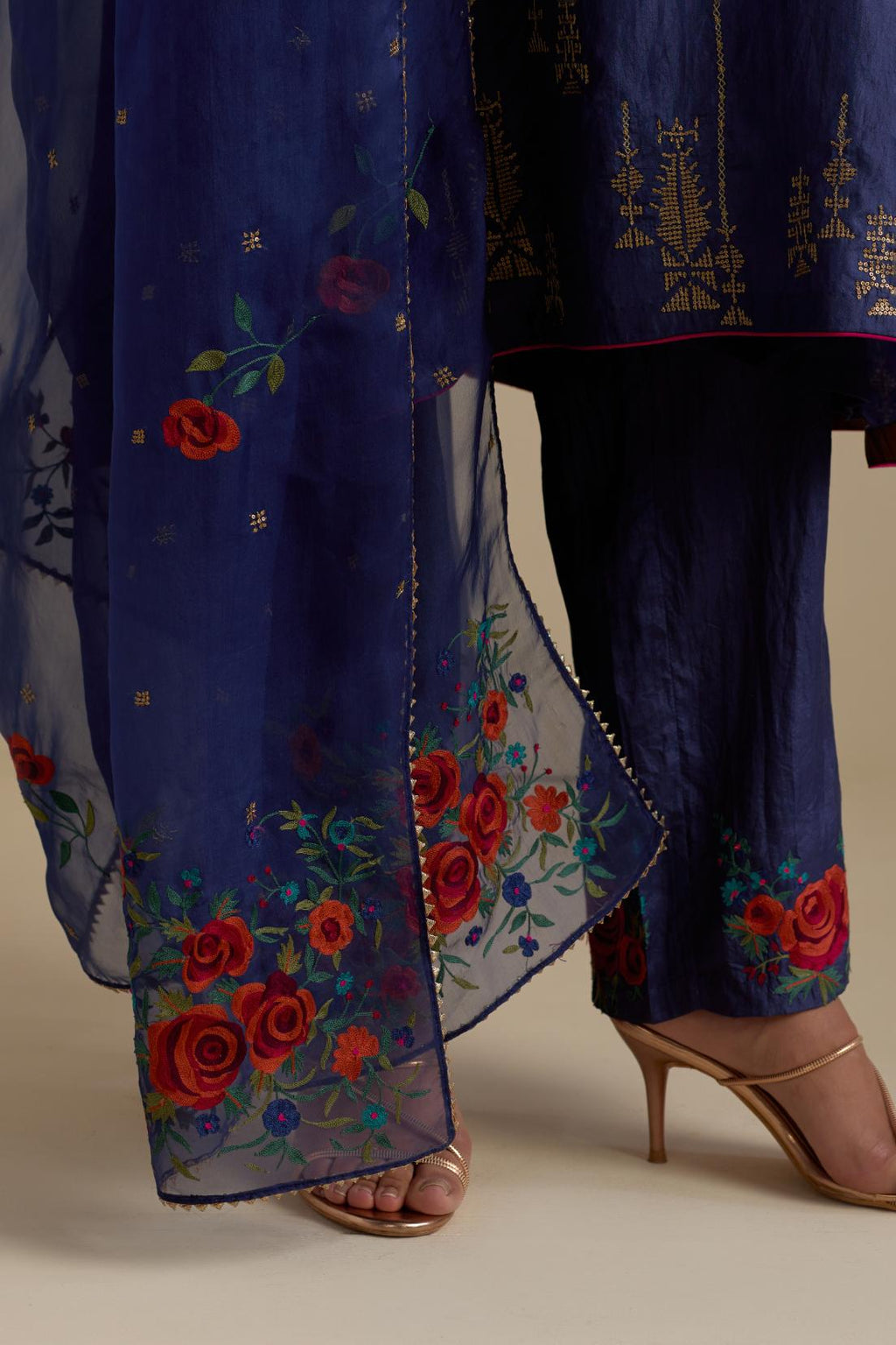 Blue silk organza dupatta, highlighted with delicate dull gold sequins work and all-over thread embroidery roses, with a large bunch at the dupatta corners.