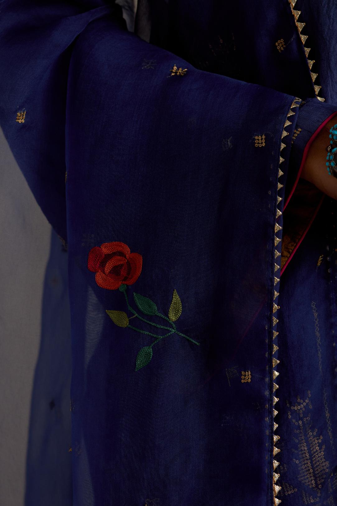 Blue silk A-line short kurta set, highlighted with dull gold zari and sequins handwork.