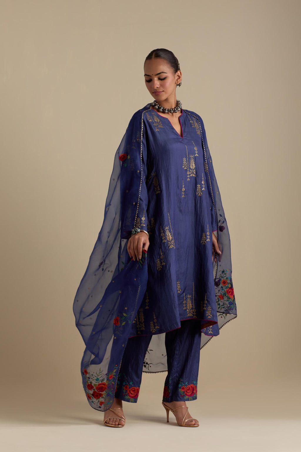 Blue silk organza dupatta, highlighted with delicate dull gold sequins work and all-over thread embroidery roses, with a large bunch at the dupatta corners.