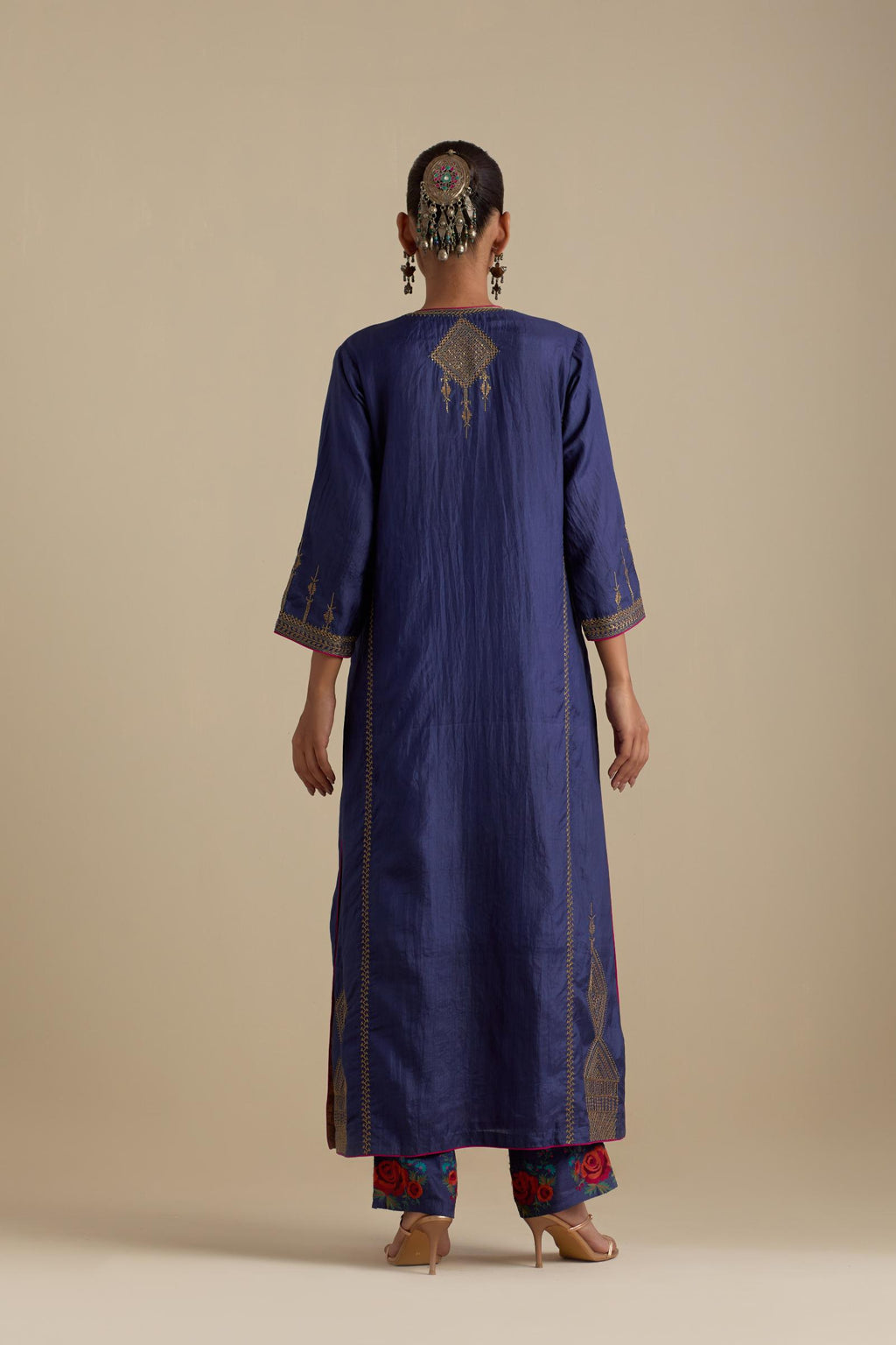 Blue silk straight kurta set, highlighted with dull gold zari and sequins handwork.