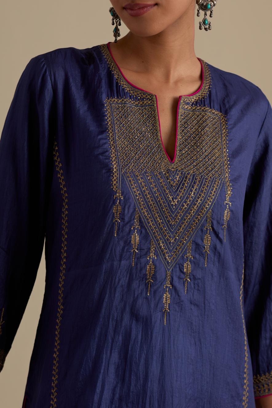 Blue silk straight kurta set, highlighted with dull gold zari and sequins handwork.