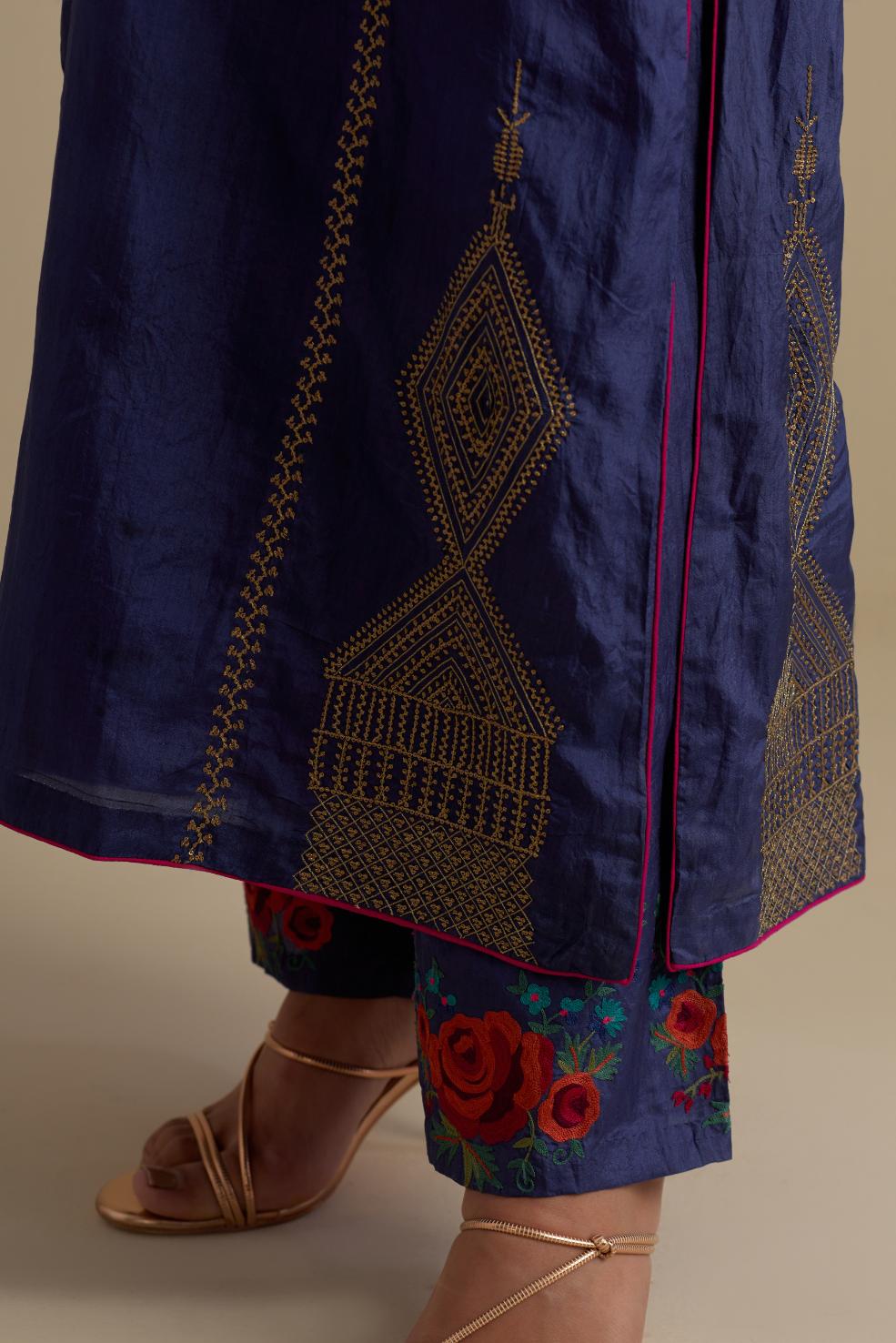 Blue silk straight kurta set, highlighted with dull gold zari and sequins handwork.