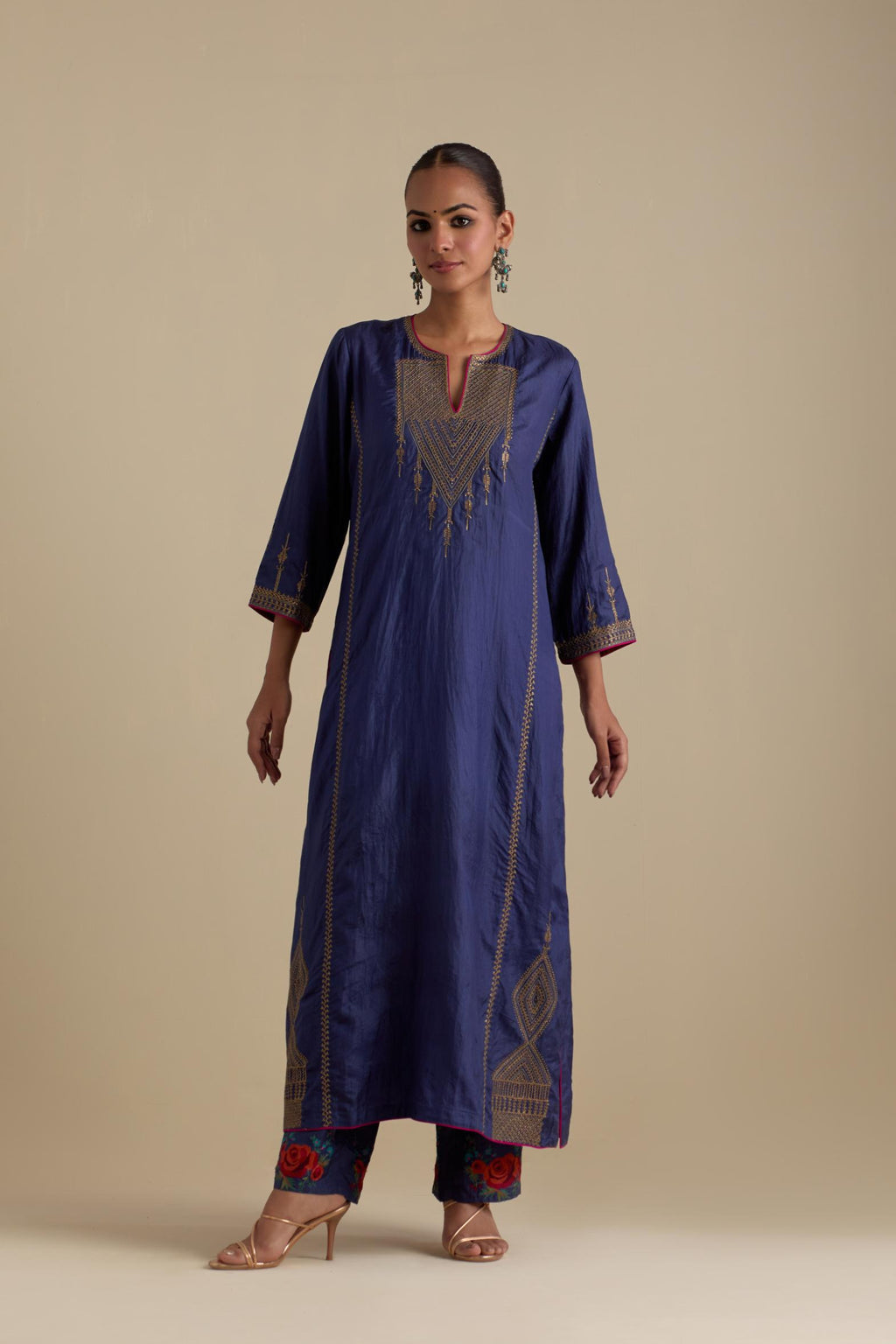 Blue silk straight kurta set, highlighted with dull gold zari and sequins handwork.