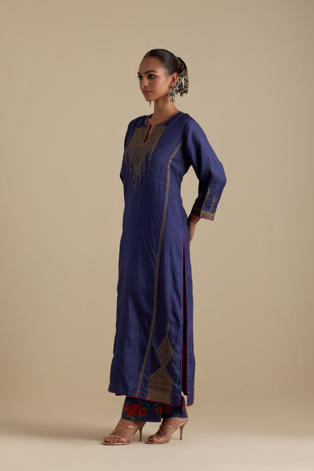 Blue silk straight kurta set, highlighted with dull gold zari and sequins handwork.