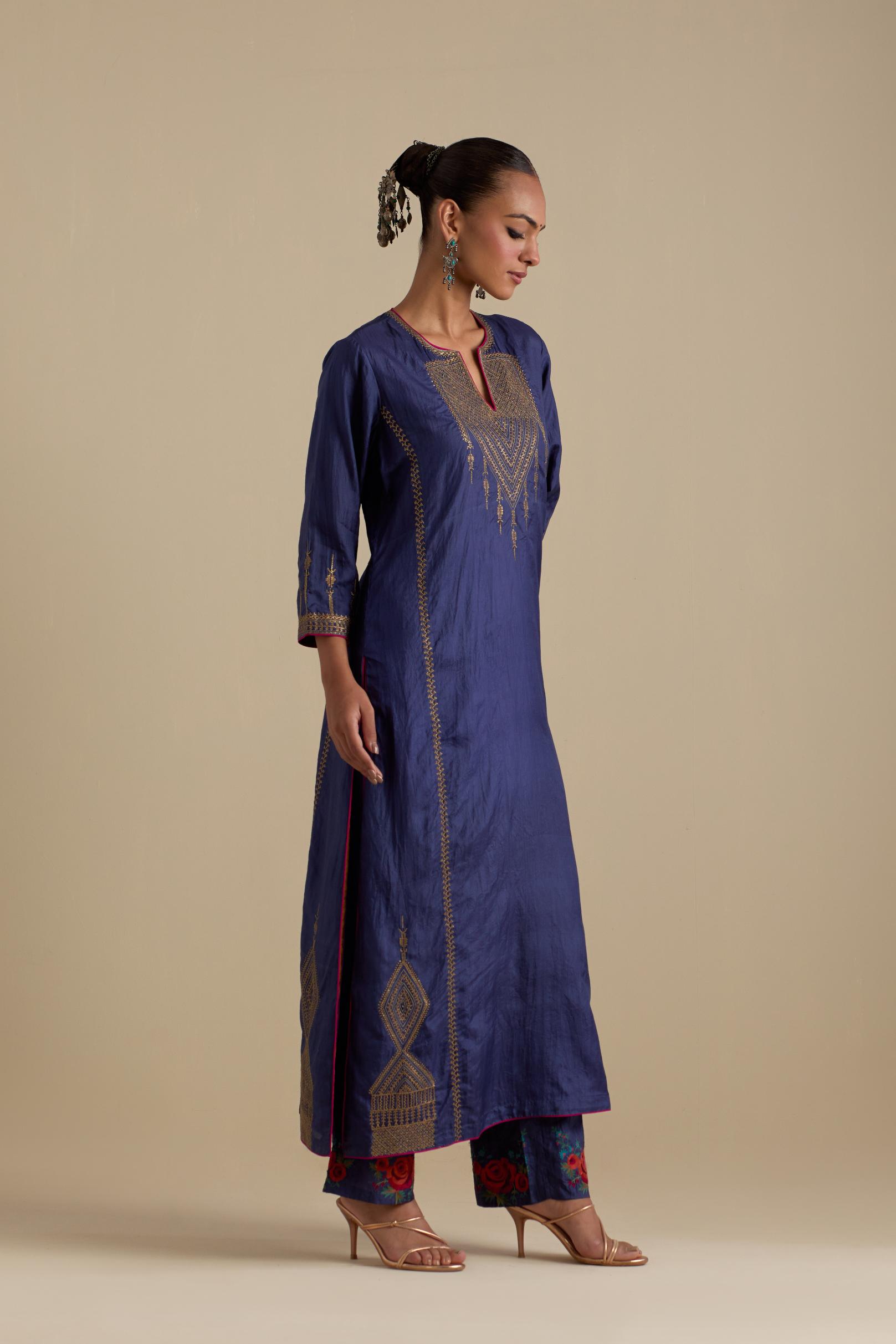 Blue silk straight kurta set, highlighted with dull gold zari and sequins handwork.