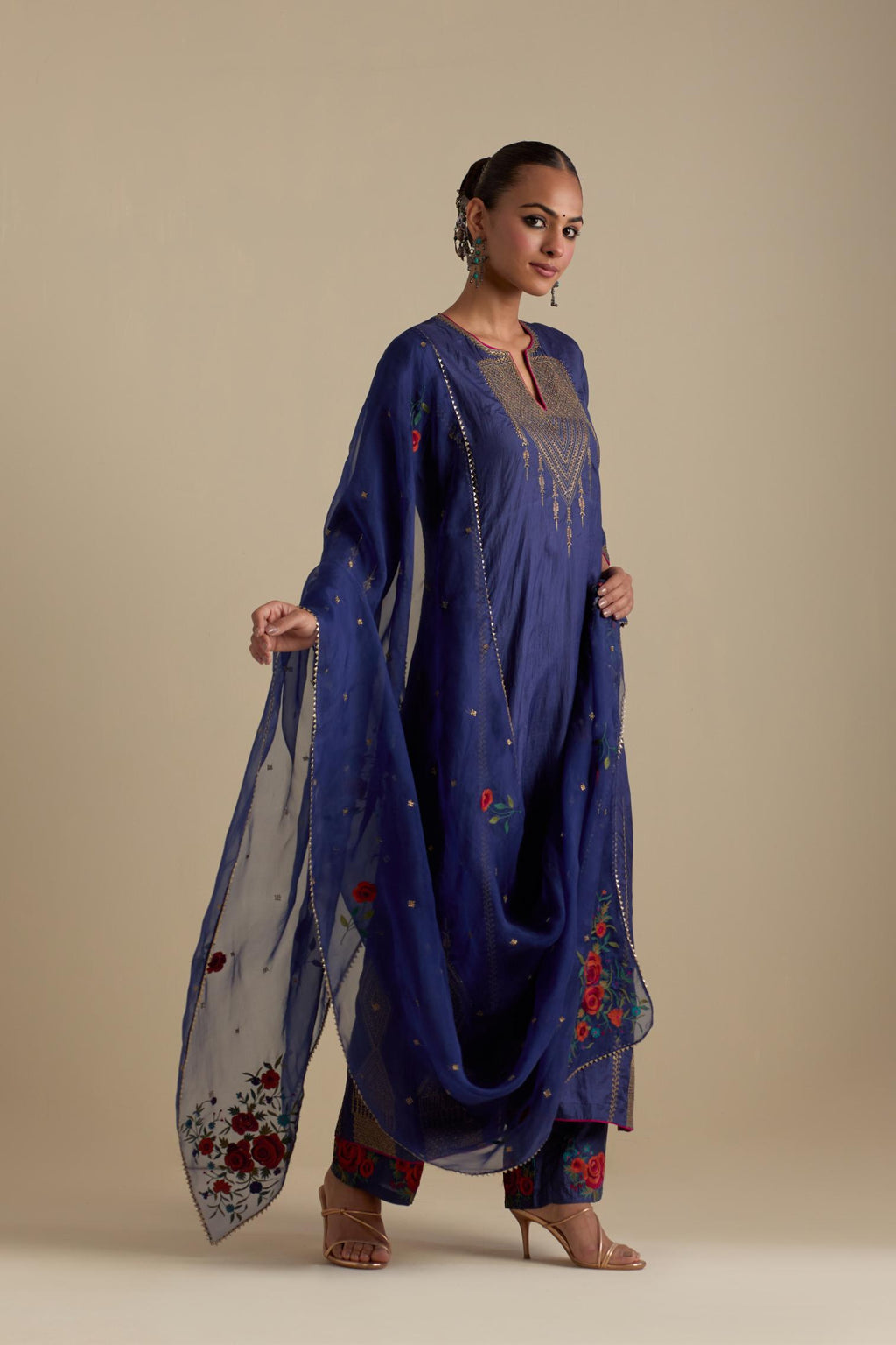 Blue silk organza dupatta, highlighted with delicate dull gold sequins work and all-over thread embroidery roses, with a large bunch at the dupatta corners.