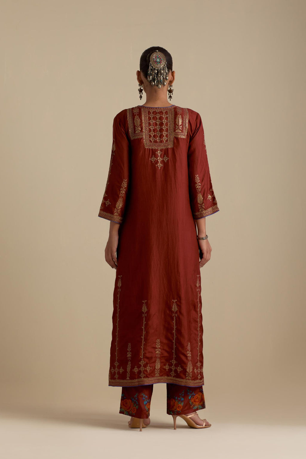 Maroon silk straight kurta set, highlighted with dull gold zari and sequins handwork.