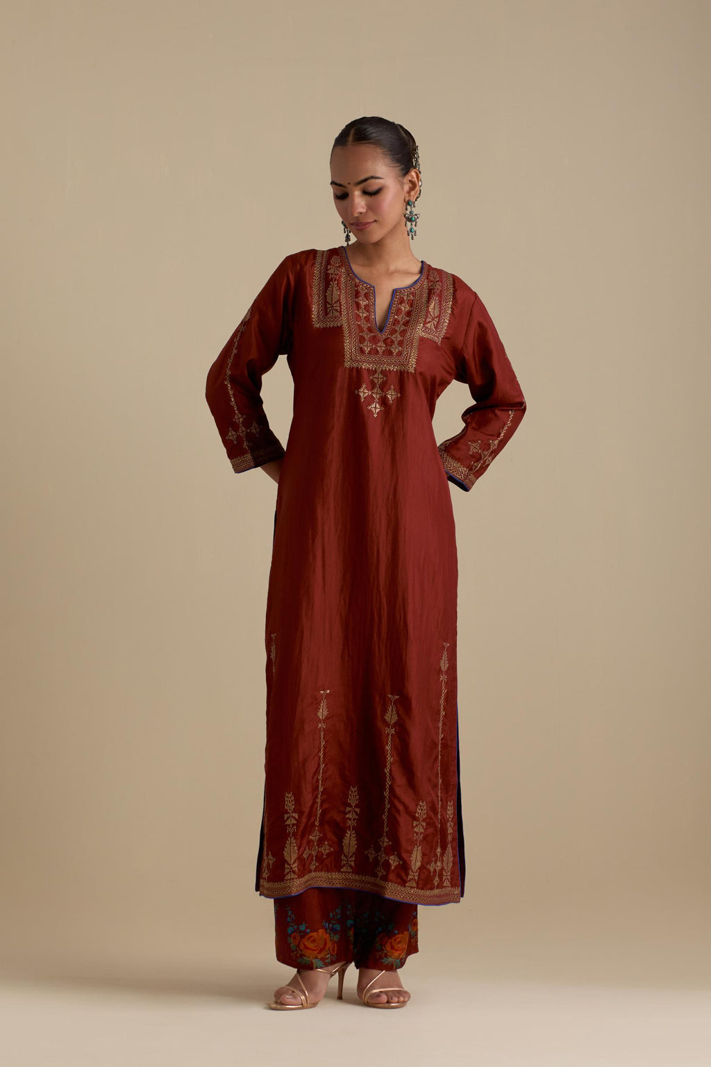 Maroon silk straight kurta set, highlighted with dull gold zari and sequins handwork.