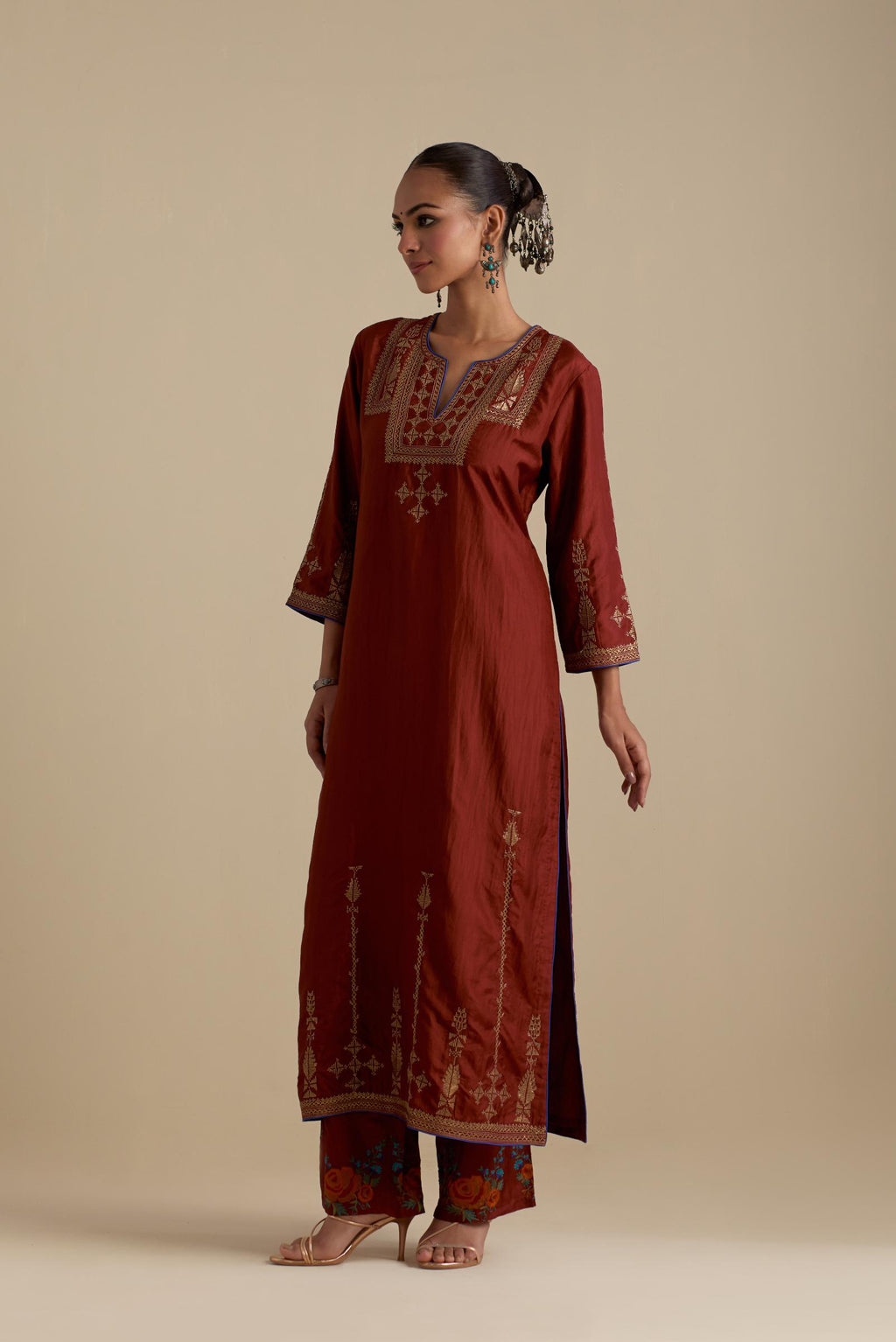 Maroon silk straight kurta set, highlighted with dull gold zari and sequins handwork.