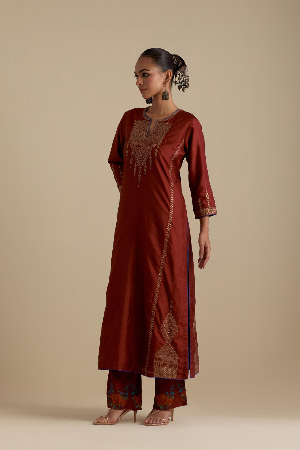 Maroon silk straight kurta set, highlighted with dull gold zari and sequins handwork.