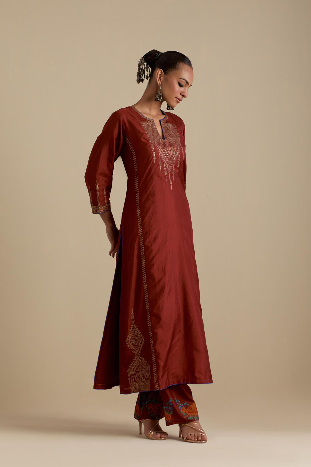 Maroon silk straight kurta set, highlighted with dull gold zari and sequins handwork.