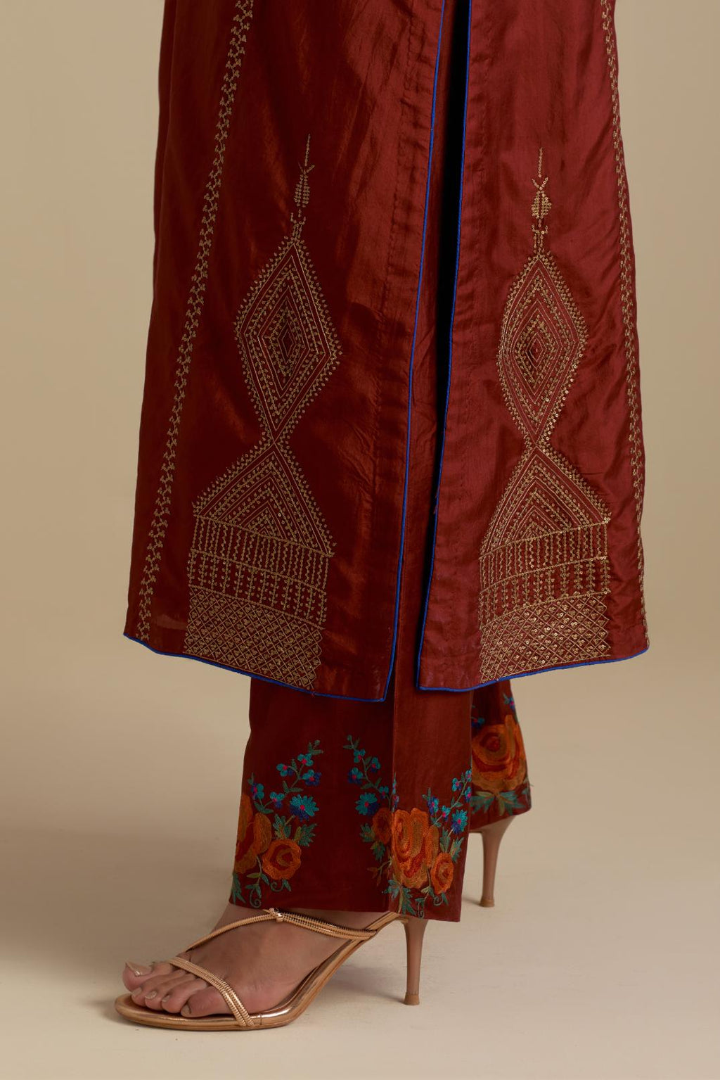 Maroon silk straight kurta set, highlighted with dull gold zari and sequins handwork.