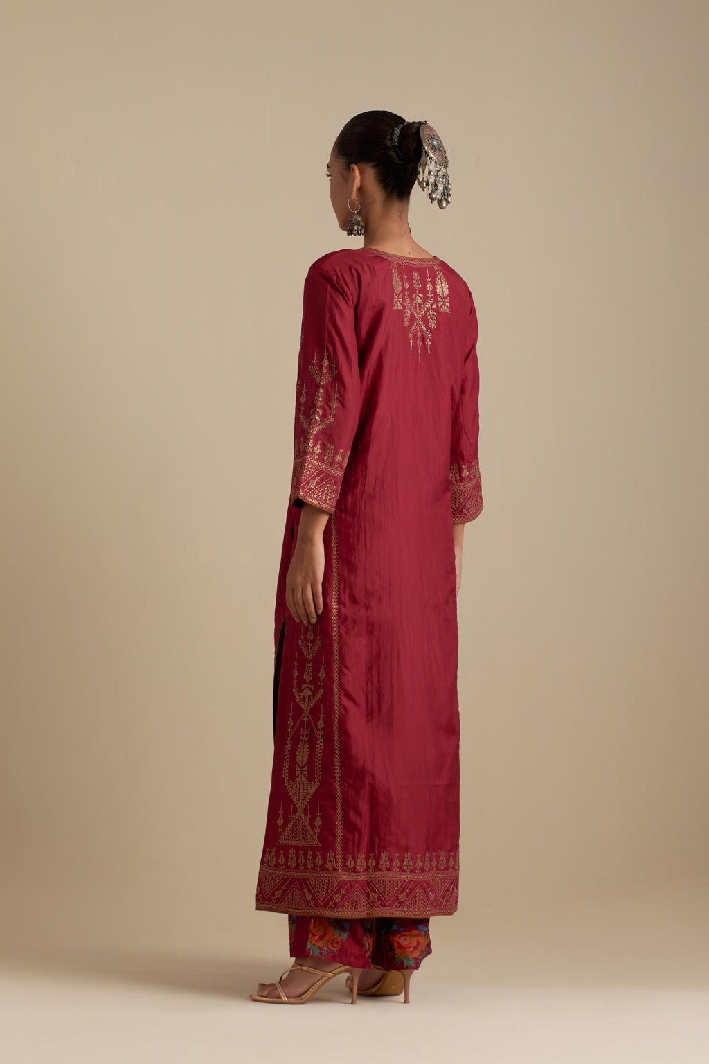 Barn red silk straight long kurta set with side panels, highlighted with dull gold zari and sequins handwork.