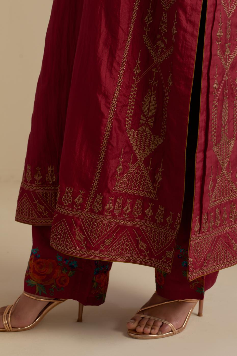 Maroon silk straight kurta set, highlighted with dull gold zari and sequins handwork.