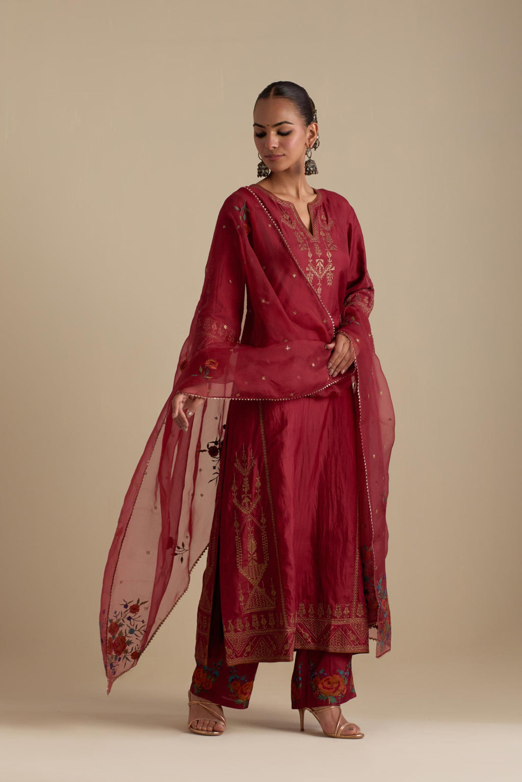 Barn red silk organza dupatta, highlighted with delicate dull gold sequins work and all-over thread embroidery roses, with a large bunch at the dupatta corners.