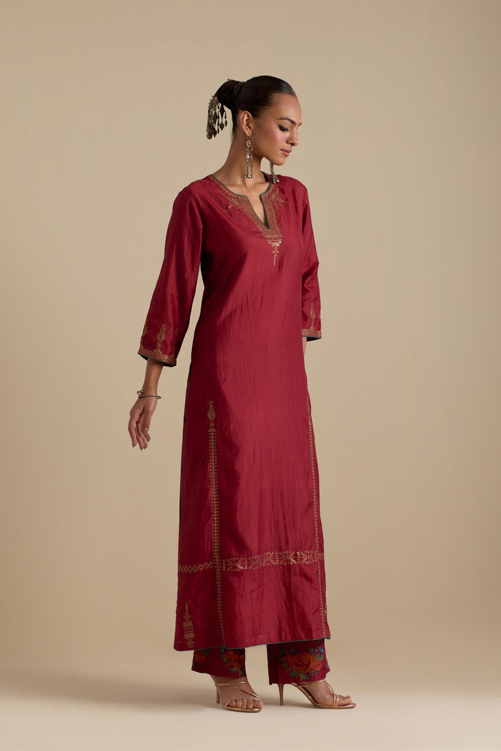 Barn red silk straight kurta set, highlighted with dull gold zari and sequins handwork