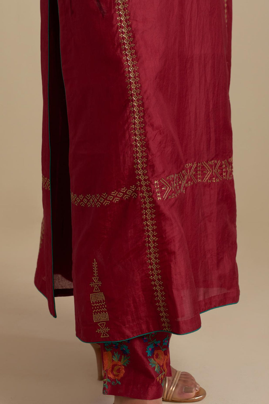 Barn red silk straight kurta set, highlighted with dull gold zari and sequins handwork