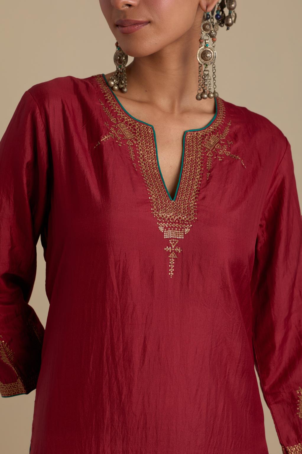 Barn red silk straight kurta set, highlighted with dull gold zari and sequins handwork