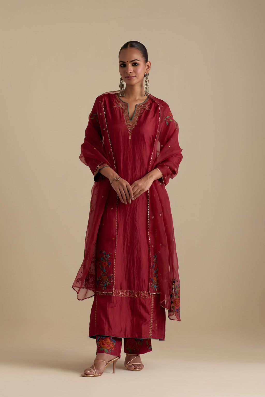 Barn red silk straight kurta set, highlighted with dull gold zari and sequins handwork