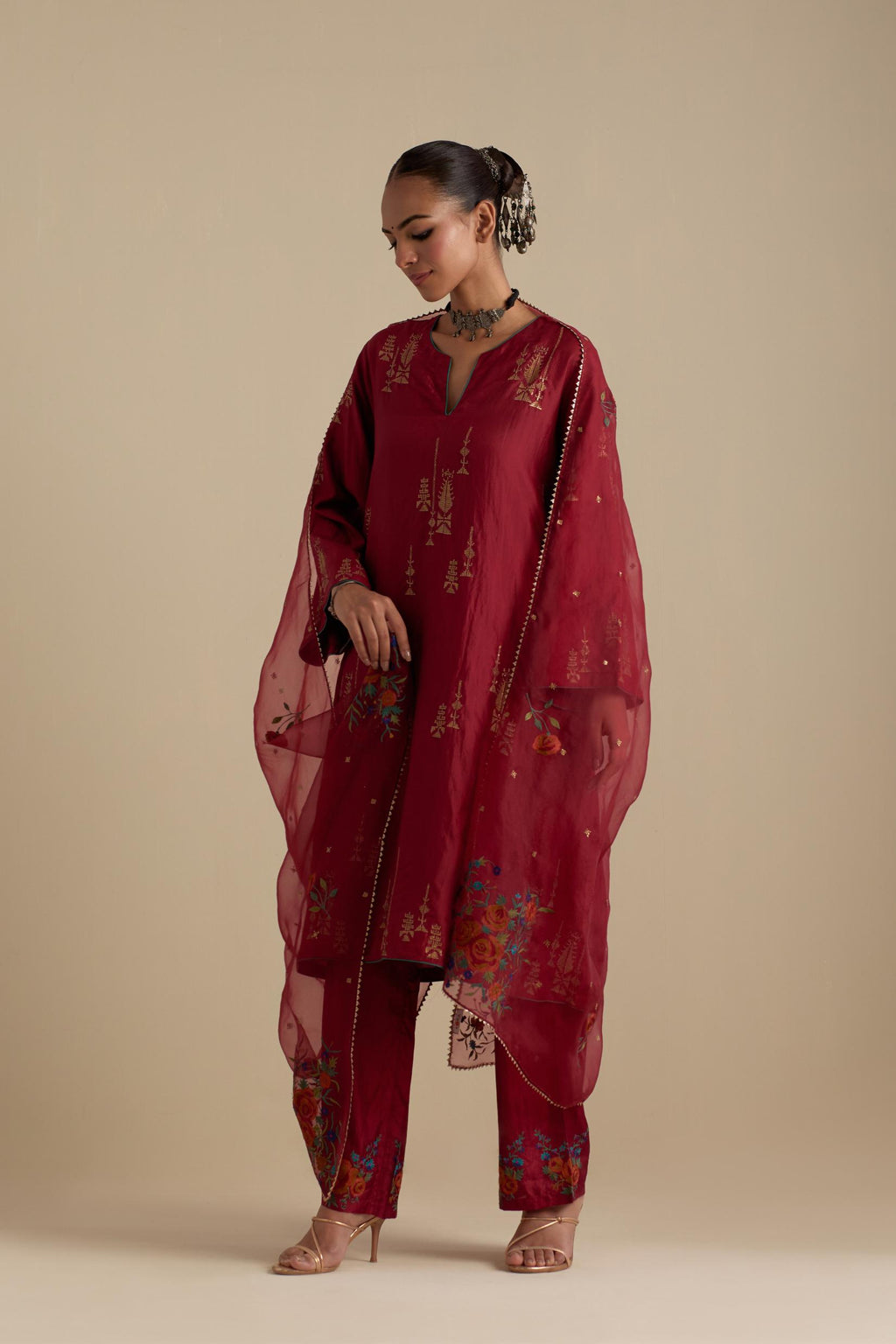 Barn red silk A-line short kurta set, highlighted with dull gold zari and sequins handwork.