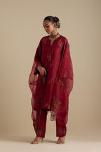 Barn red silk A-line short kurta set, highlighted with dull gold zari and sequins handwork.