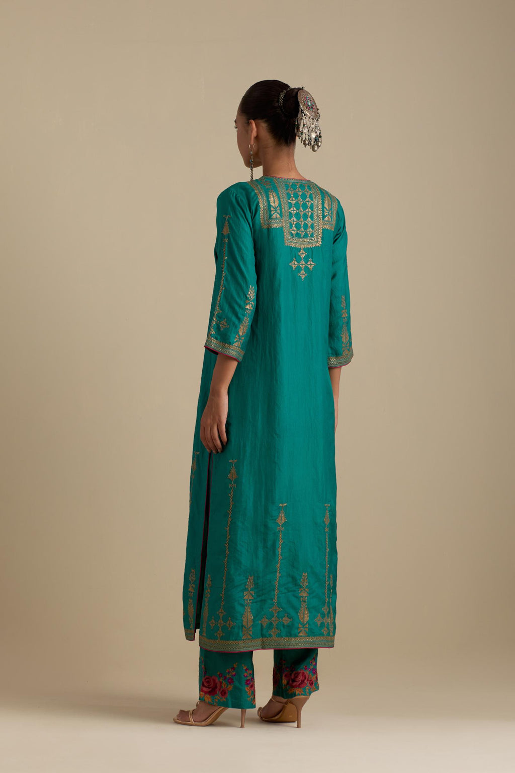 Persian green silk straight kurta set, highlighted with dull gold zari and sequins handwork.