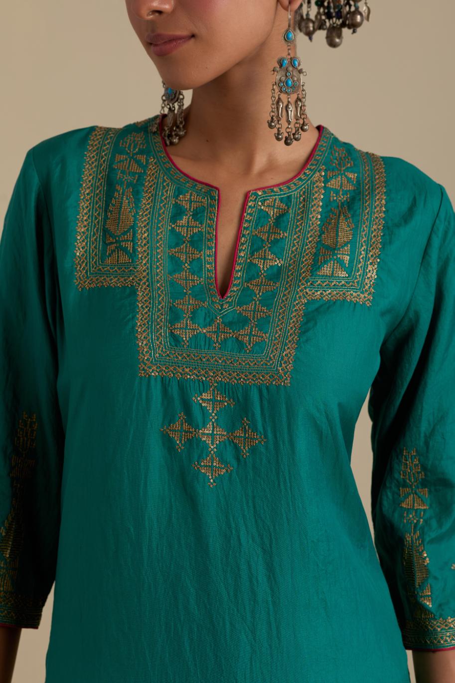 Persian green silk straight kurta set, highlighted with dull gold zari and sequins handwork.