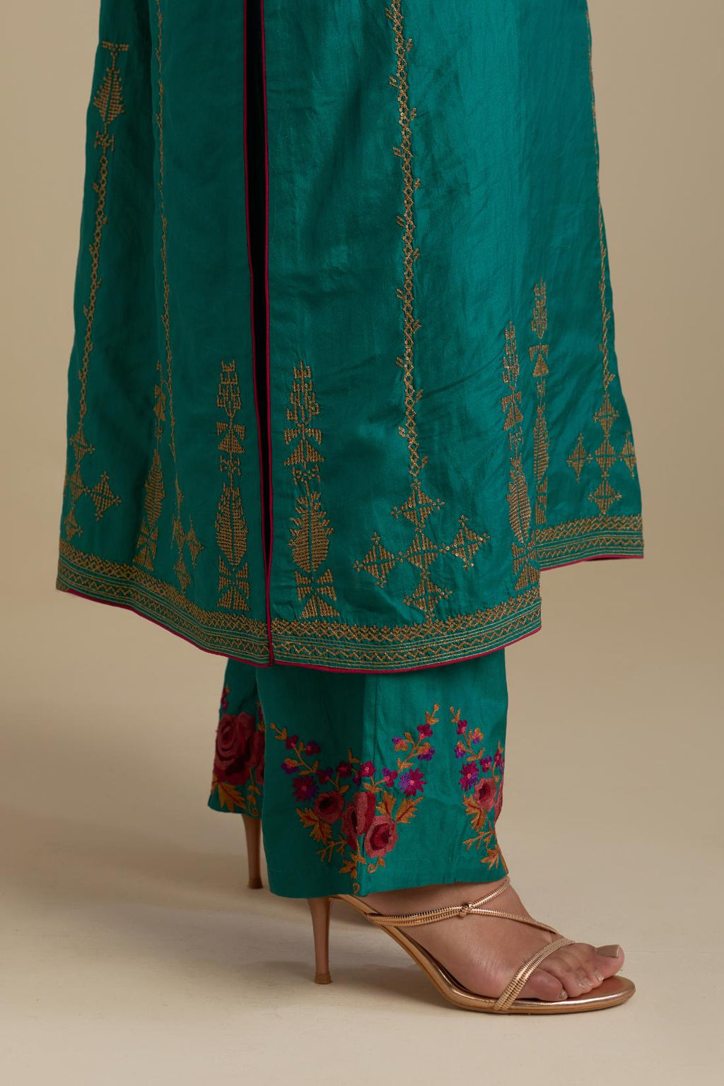 Persian green silk straight kurta set, highlighted with dull gold zari and sequins handwork.