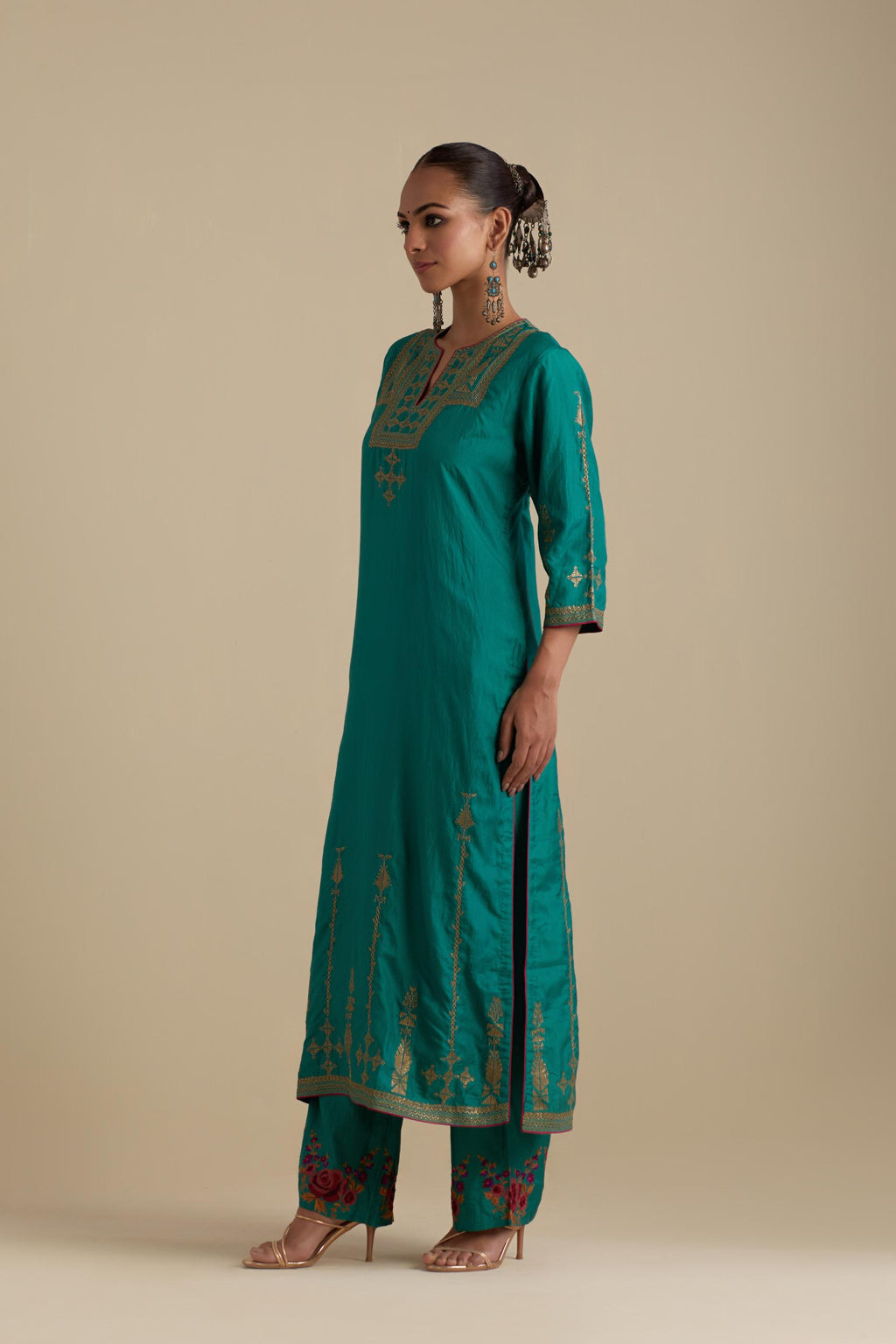 Persian green silk straight kurta set, highlighted with dull gold zari and sequins handwork.