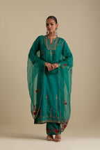Persian green silk straight kurta set, highlighted with dull gold zari and sequins handwork.