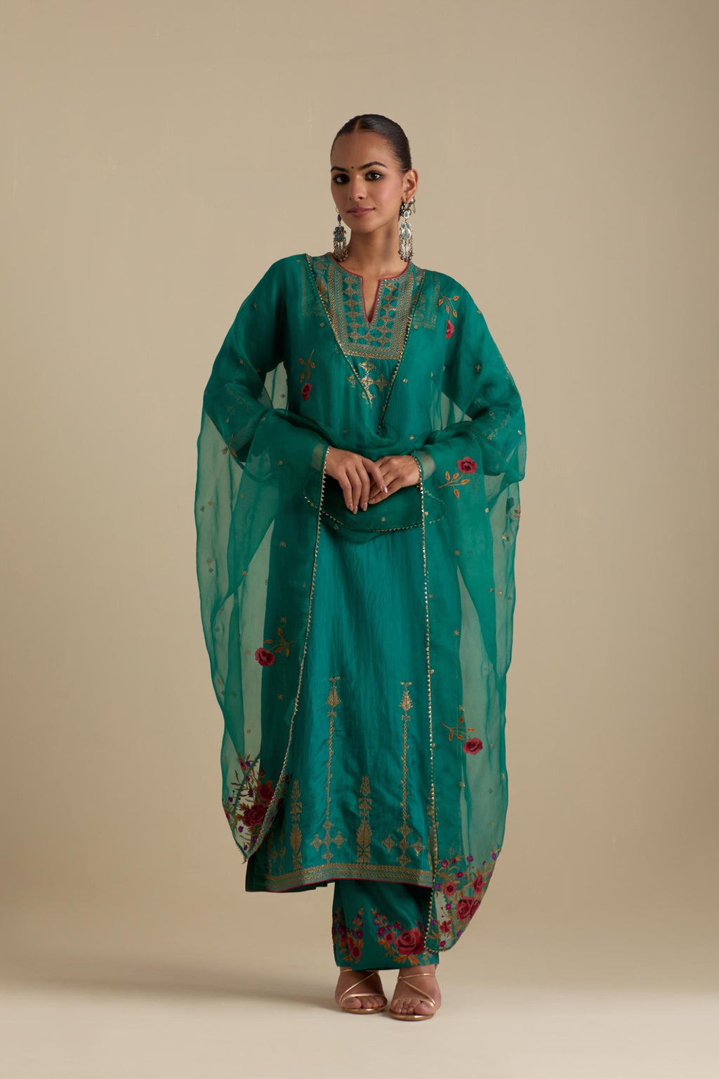 Persian green silk straight kurta set, highlighted with dull gold zari and sequins handwork.