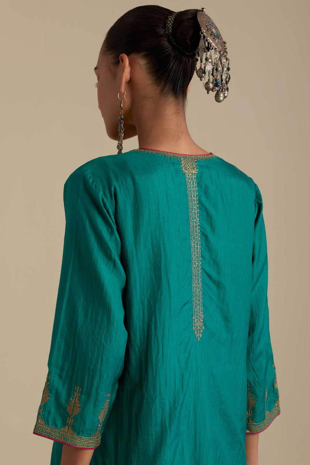 Persian green silk straight kurta set, highlighted with dull gold zari and sequins handwork