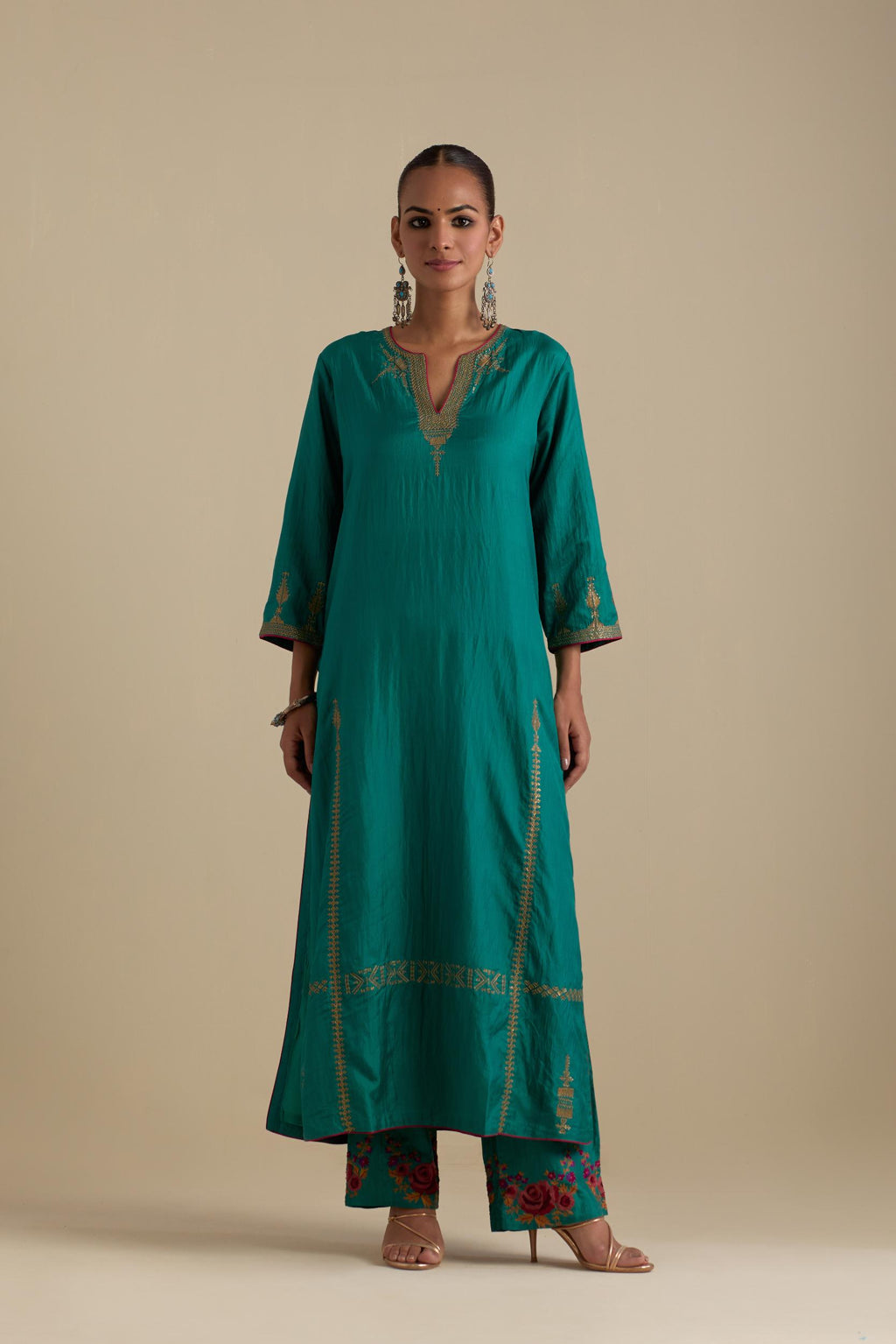 Persian green silk straight kurta set, highlighted with dull gold zari and sequins handwork