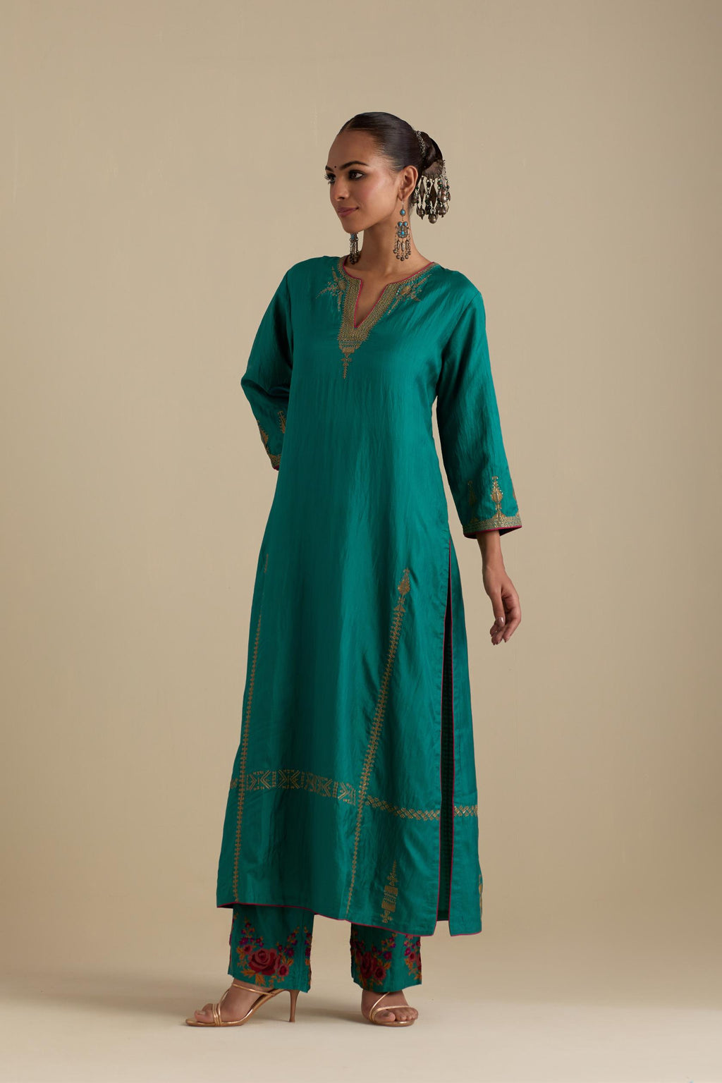 Persian green silk straight kurta set, highlighted with dull gold zari and sequins handwork