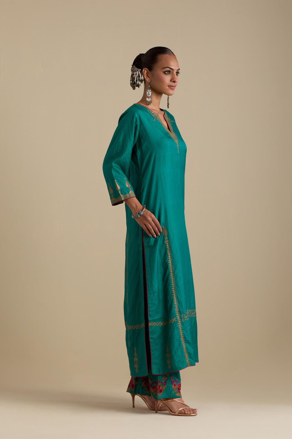 Persian green silk straight kurta set, highlighted with dull gold zari and sequins handwork