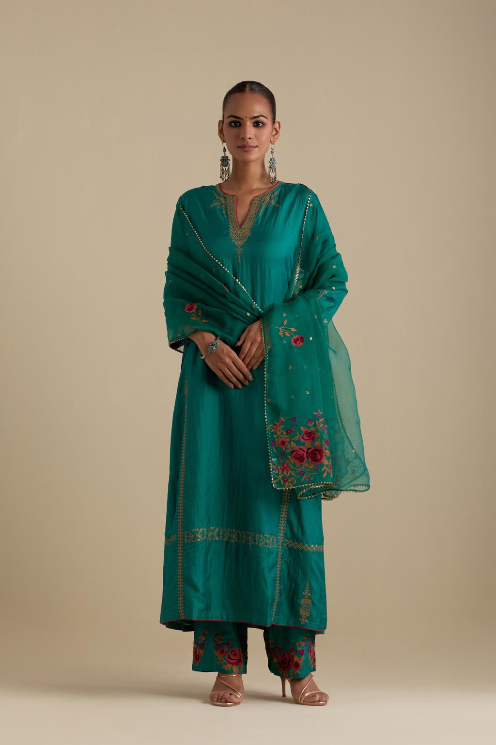 Persian green silk straight kurta set, highlighted with dull gold zari and sequins handwork