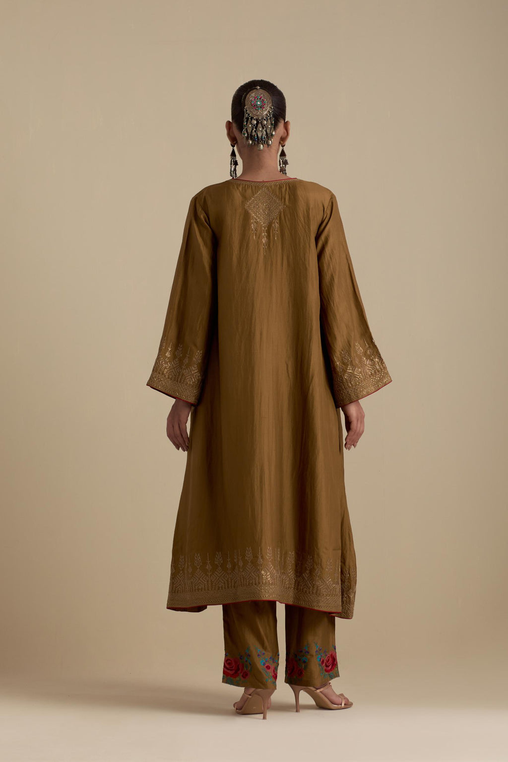 Olive knee length A-line kurta set, highlighted with dull gold zari and sequins handwork.