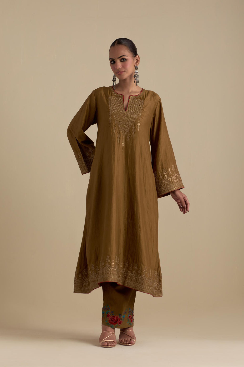 Olive knee length A-line kurta set, highlighted with dull gold zari and sequins handwork.