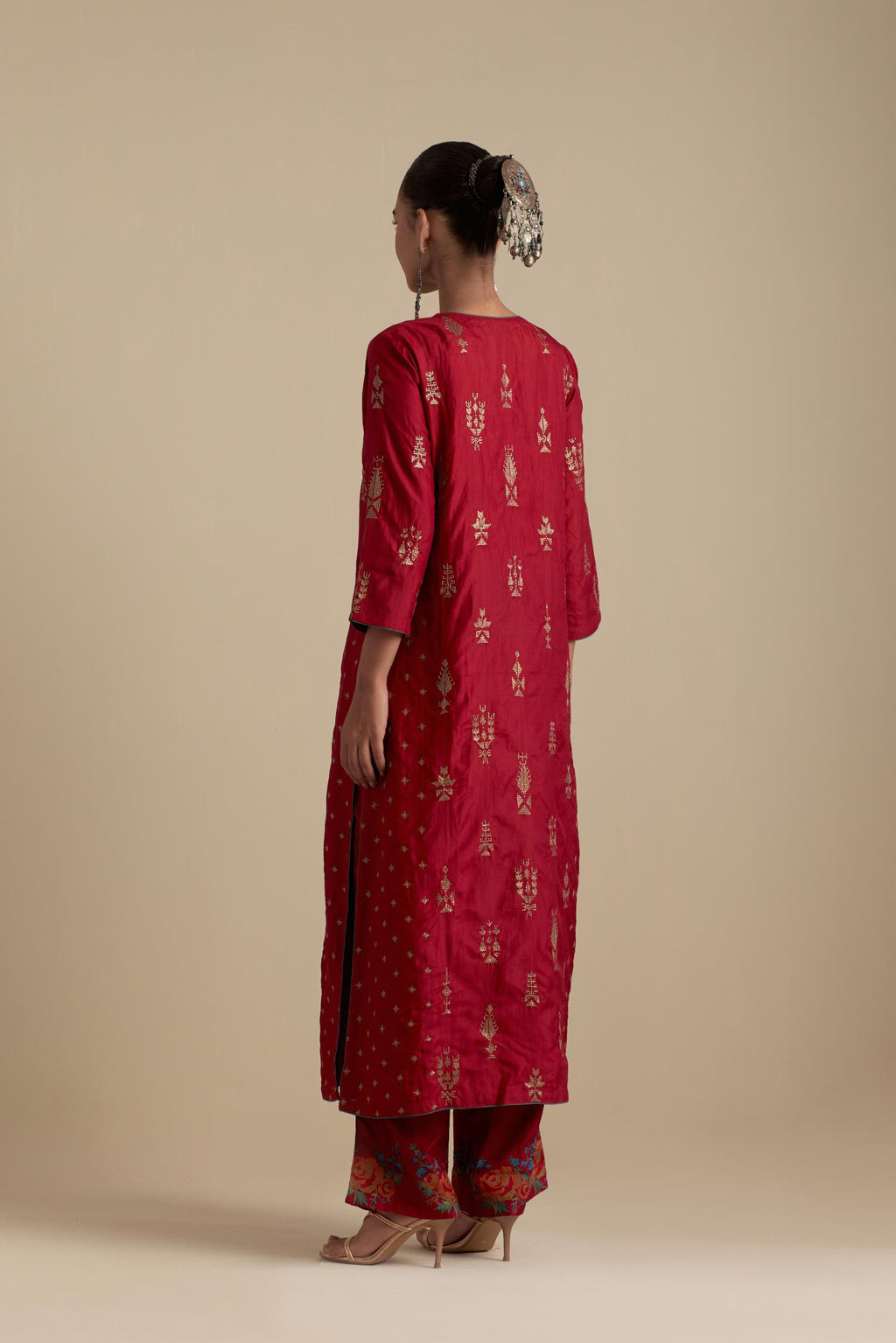 Barn red silk straight kurta set with side panels, highlighted with dull gold zari and sequins handwork.