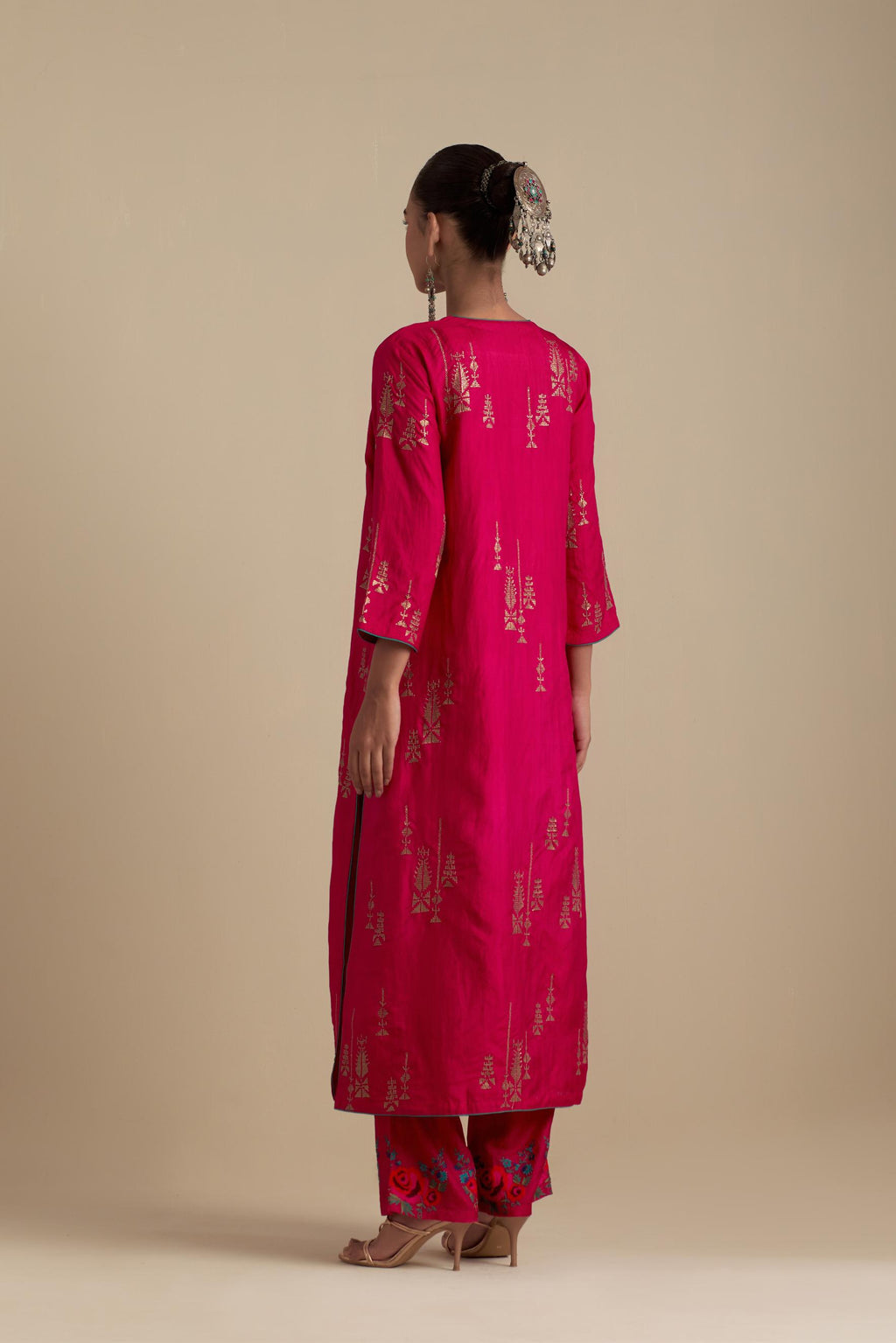 Fuchsia silk straight kurta set, highlighted with dull gold zari and sequins handwork.