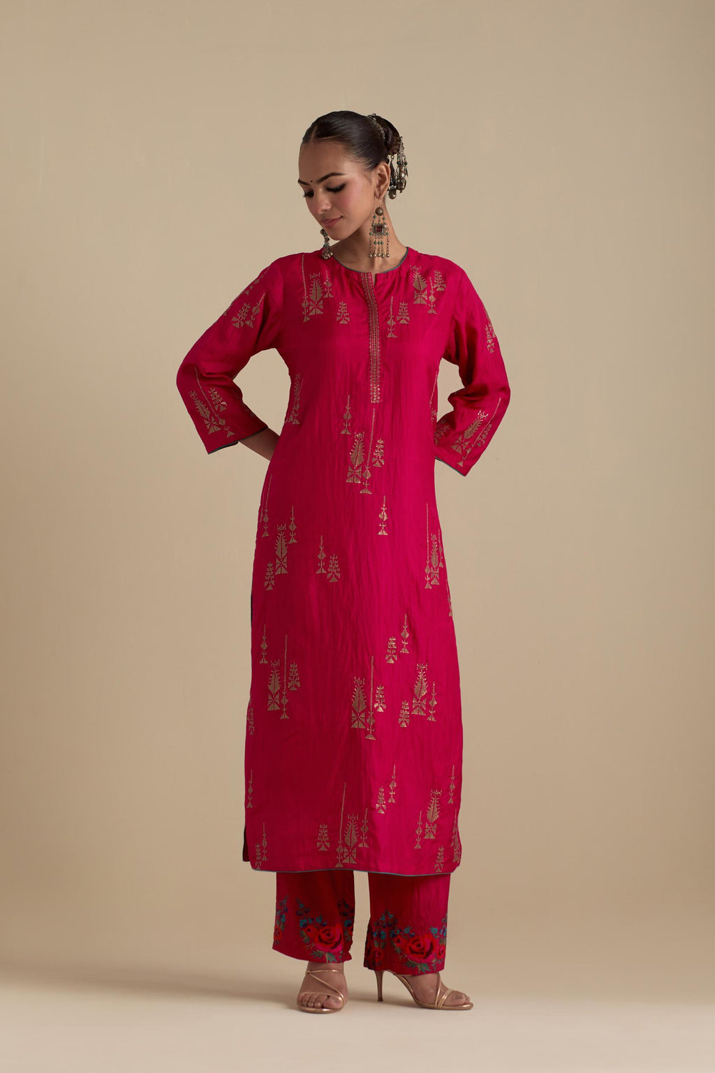 Fuchsia silk straight kurta set, highlighted with dull gold zari and sequins handwork.