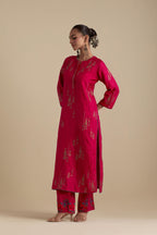 Fuchsia silk straight kurta set, highlighted with dull gold zari and sequins handwork.